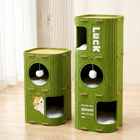 Green felt bucket cat tree placed near window in modern small apartment
